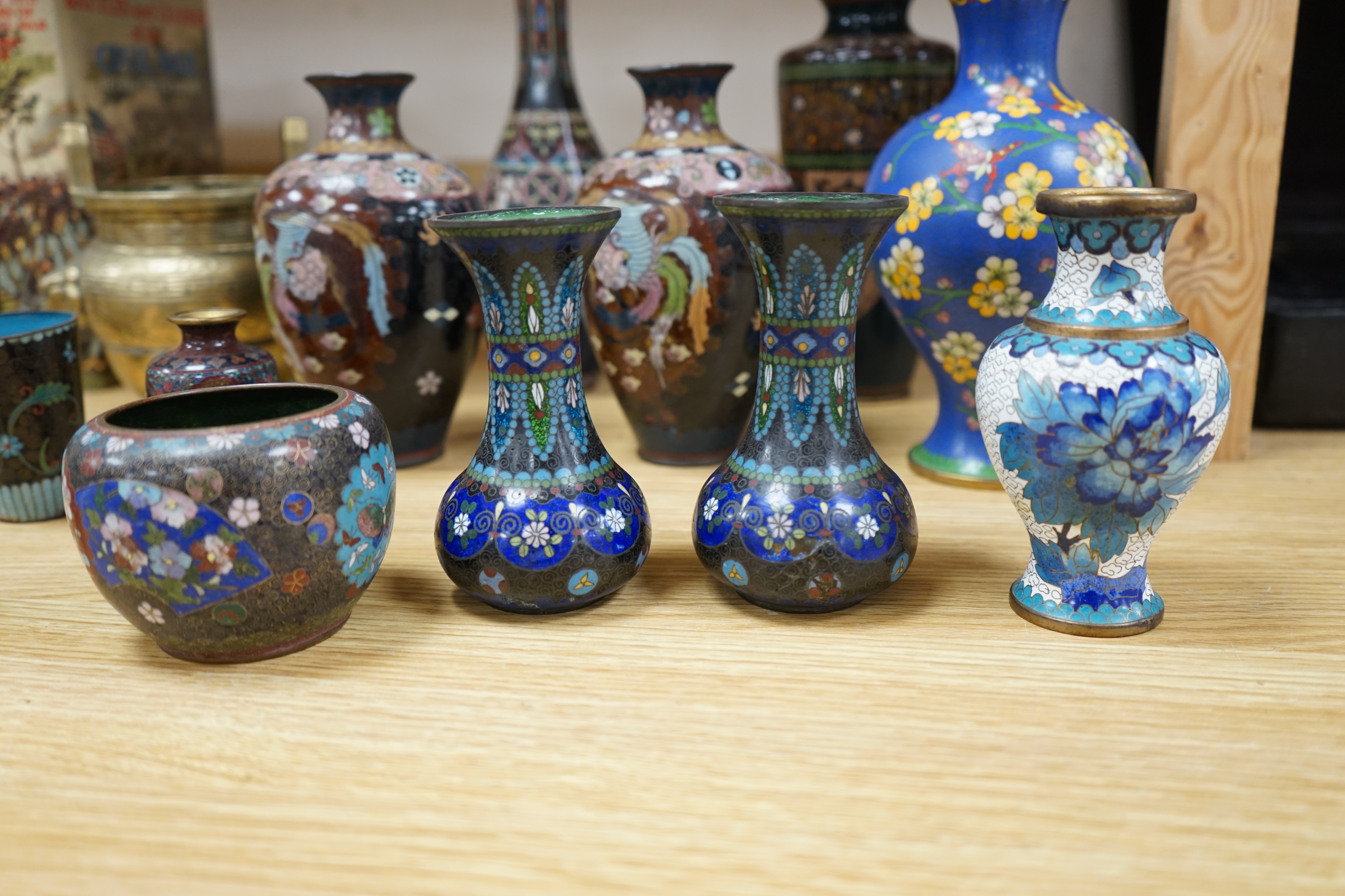 A large collection of Chinese and Japanese cloisonné vases and a brass twin handled censer, largest 31cm high. Condition - mostly poor to fair